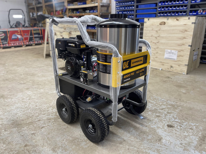 BE commercial hot water pressure washer with Power Ease engine, shrink-wrapped for shipping in warehouse