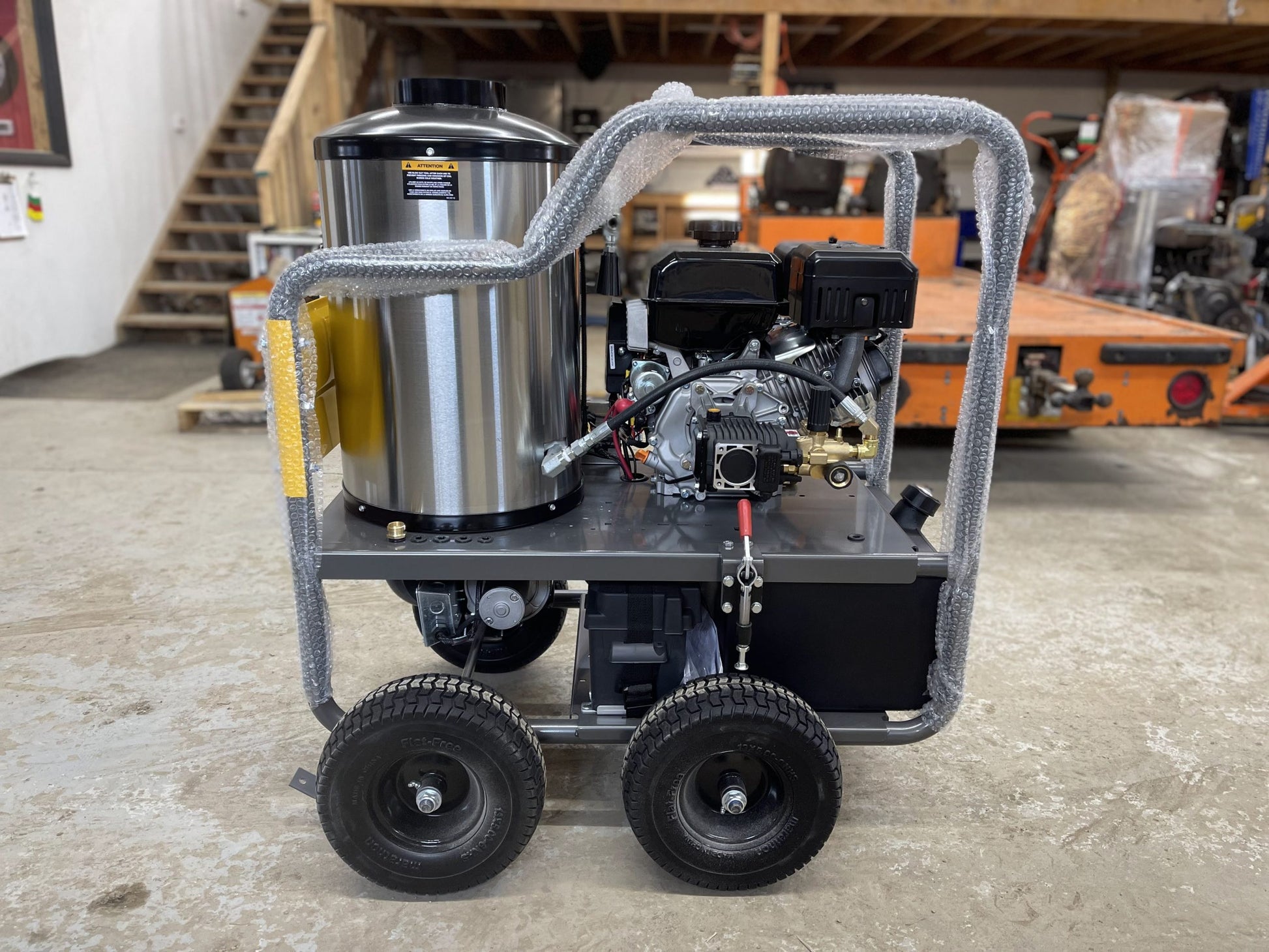 BE commercial hot water pressure washer, front-side view showing coil housing and engine