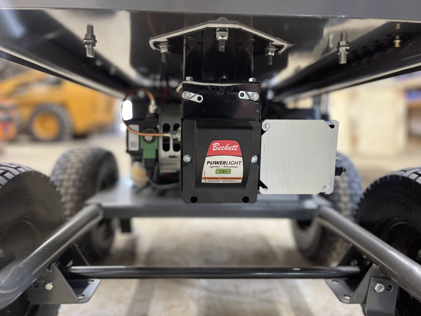 Close-up of Beckett igniter mounted underneath the BE commercial pressure washer chassis
