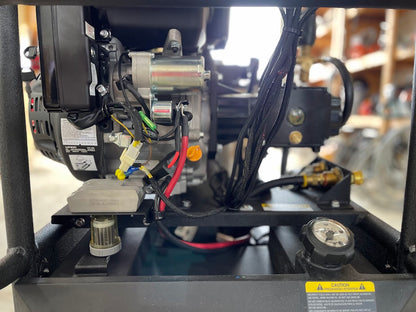 Rear view of Kärcher LFT Cage pressure washer showing electric starter motor, wiring harness, and pressure gauge