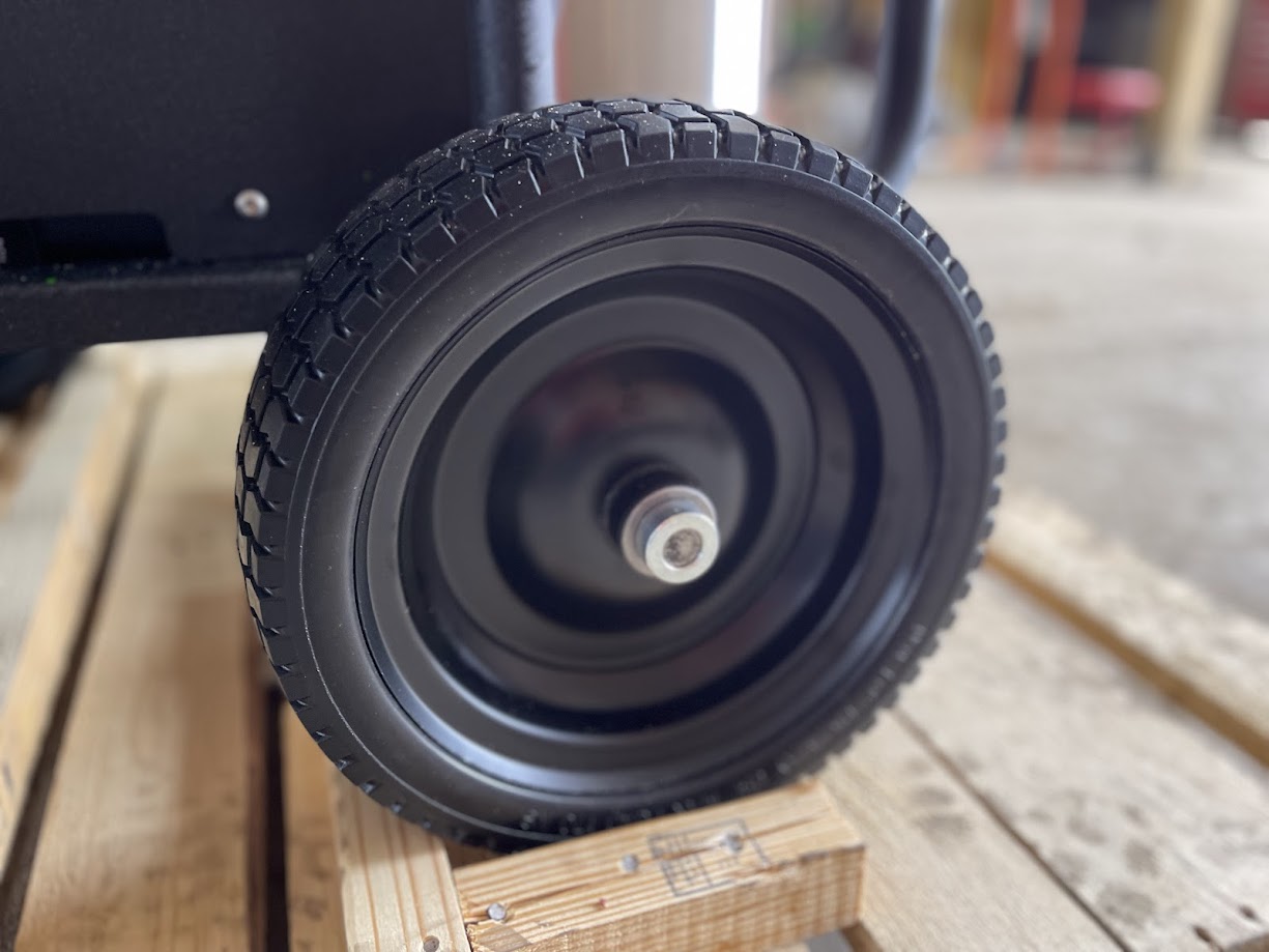 Close-up of the pneumatic wheel on the Kärcher LFT Cage pressure washer cart
