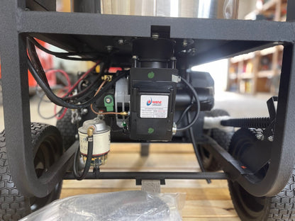 Rear underside view of the Karcher pressure washer showing burner ignitor motor, fuel filter, and wiring