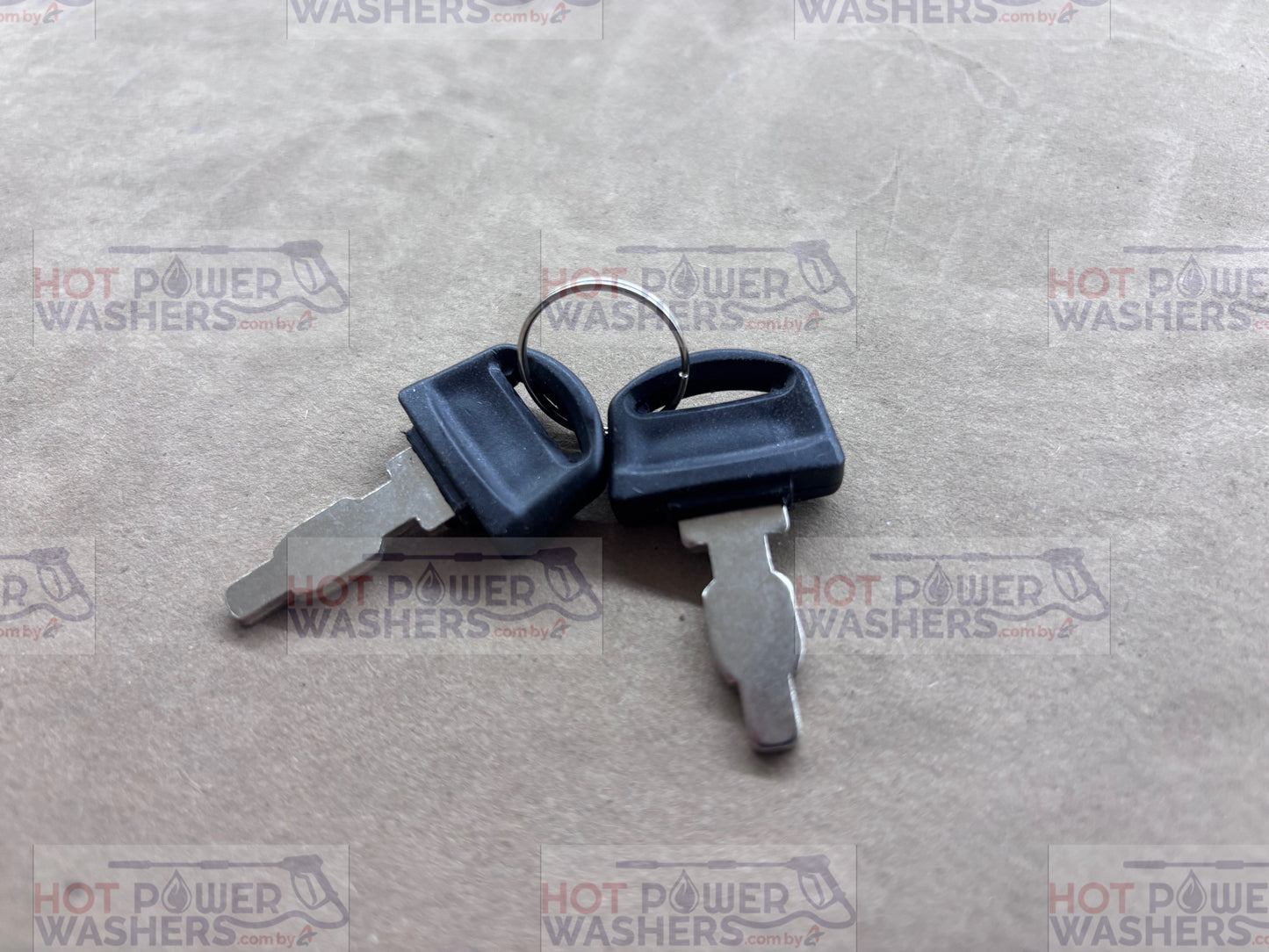 Two included keys for the Lifan ignition switch box on a gray textured surface