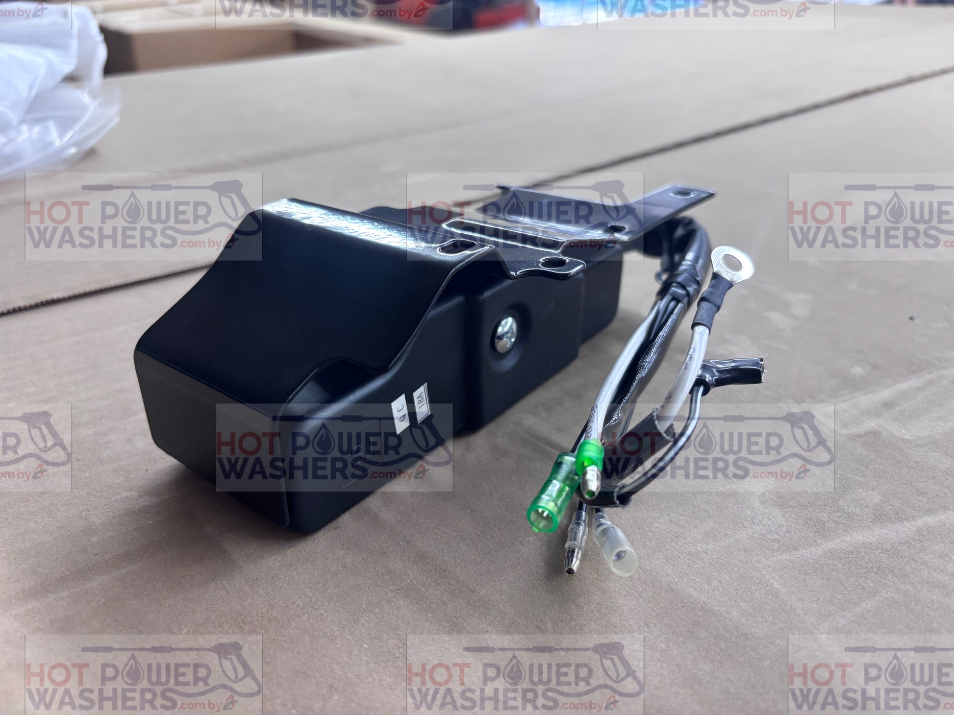 Lifan ignition switch box with attached wiring harness and connector plug on a cardboard surface