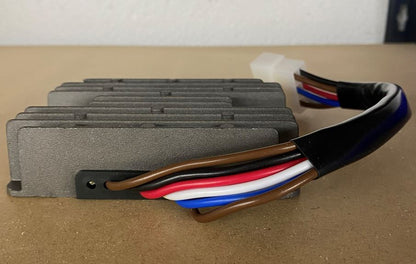 Close-up of Lifan LF188/LF190 rectifier heat sink fins and multicolored wire harness
