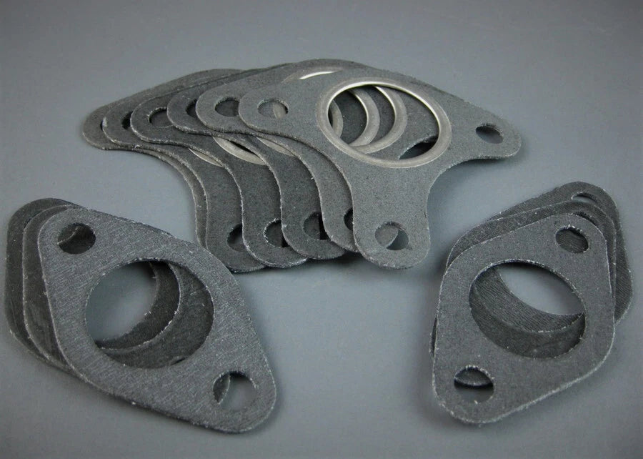 Set of six metal muffler gaskets for Honda GX390, GX340, GX270, GX240 and 188F engines on a gray background