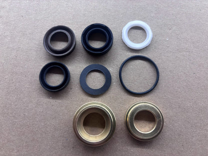 Packing seal kit components including o-rings, oil seals, and brass bushings for Magnum 4000 pump