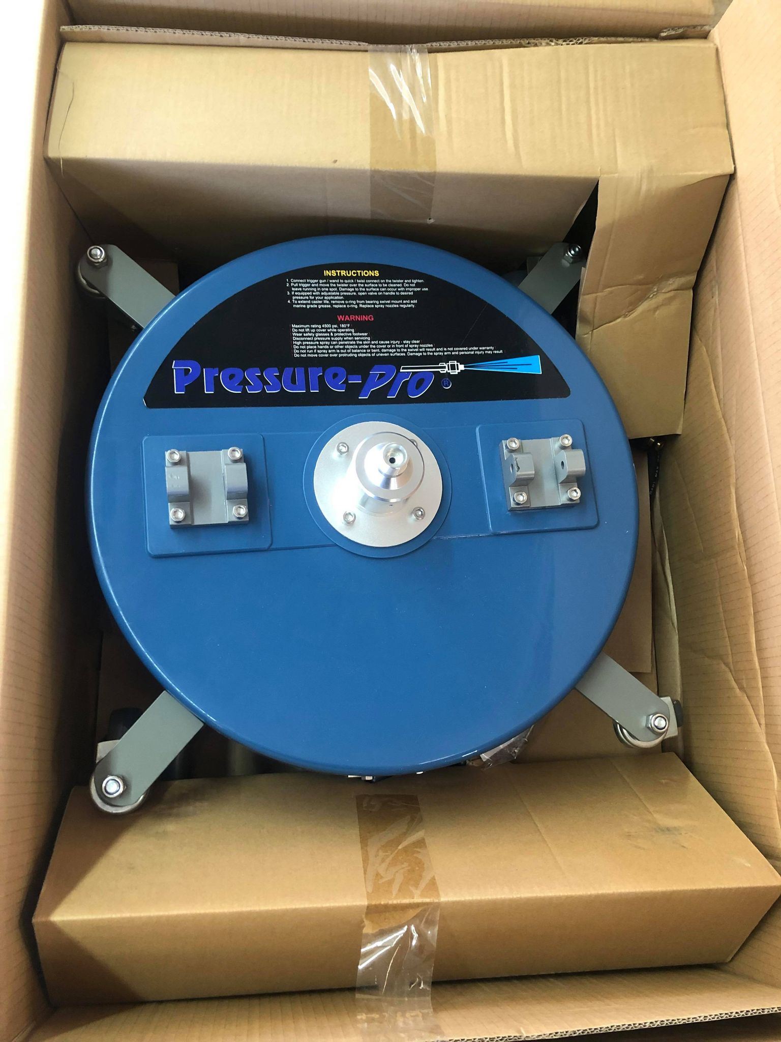 Pressure Pro PP-SC18 surface cleaner packaged in its shipping box, showing underside and brand logo