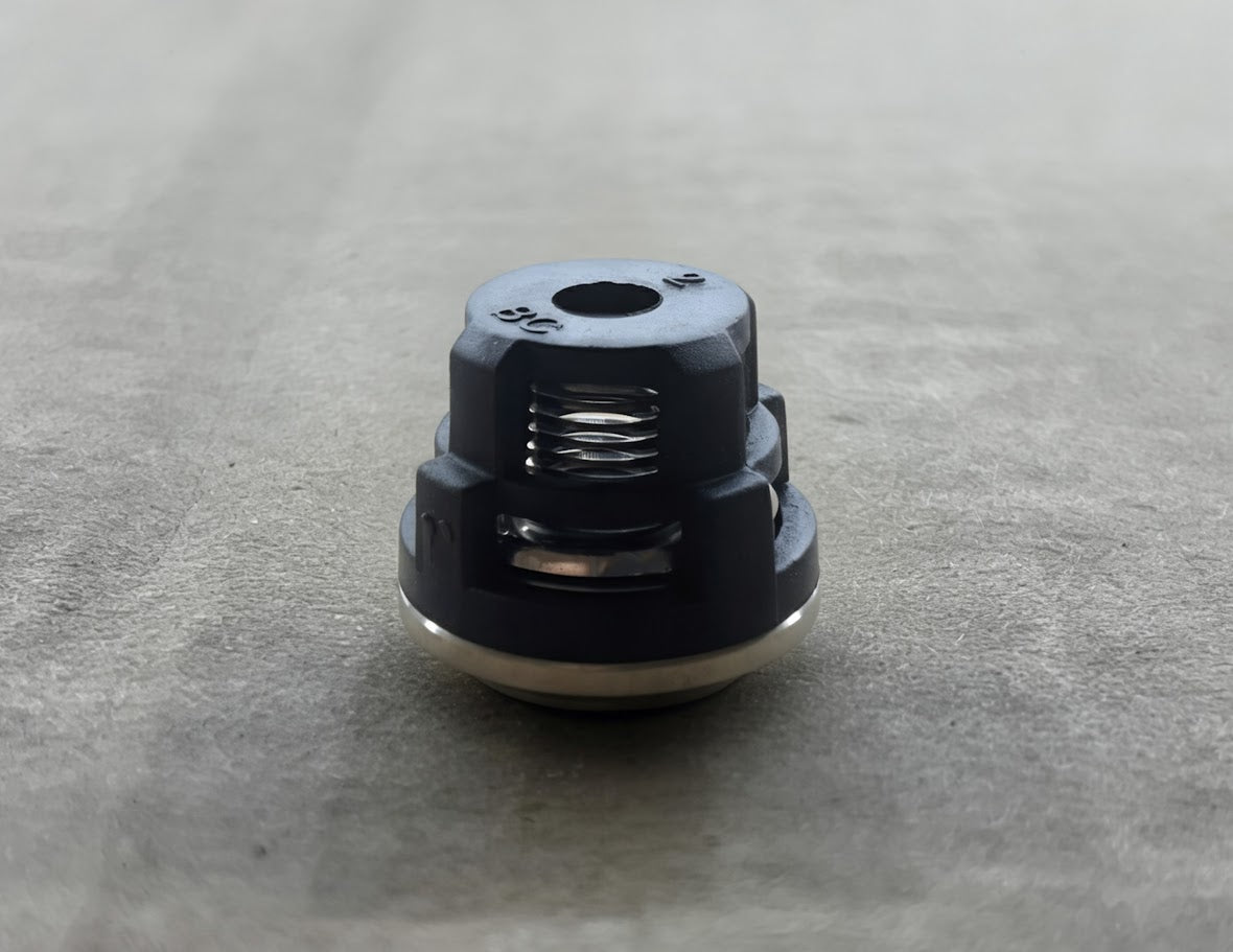 Close-up of valve cap with internal spring from the EK440, EK215H, EK3435H valve kit for Magnum 4000